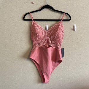 PINK BODYSUIT MEDIUM NWT SOLD